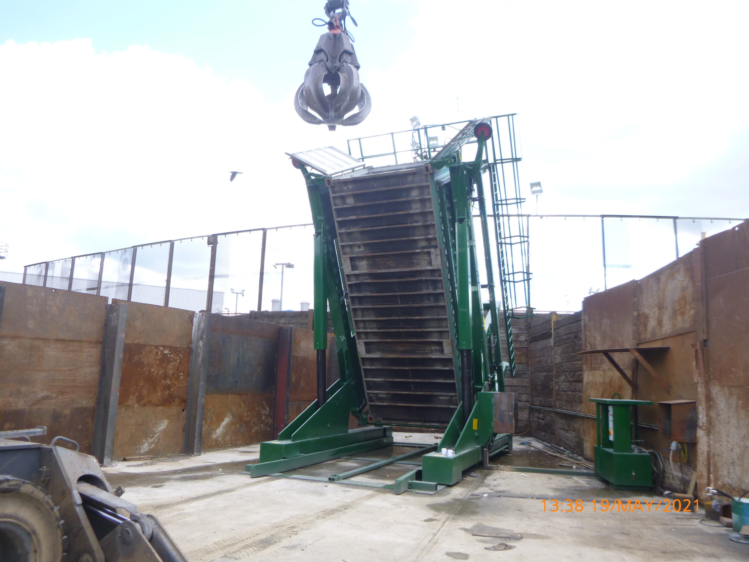 Loading a container with scrap metal