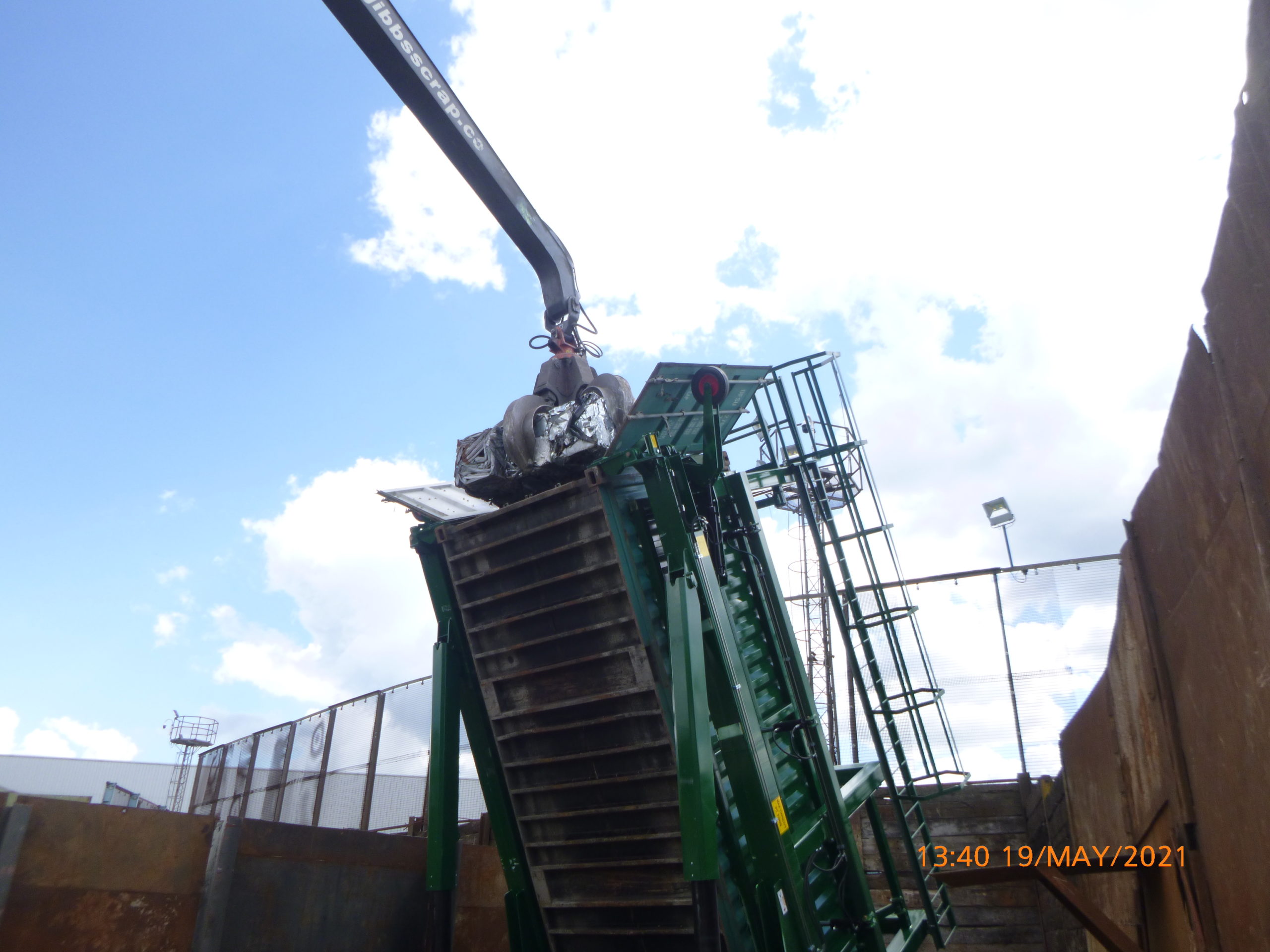 The Loading of a container with scrap metal.